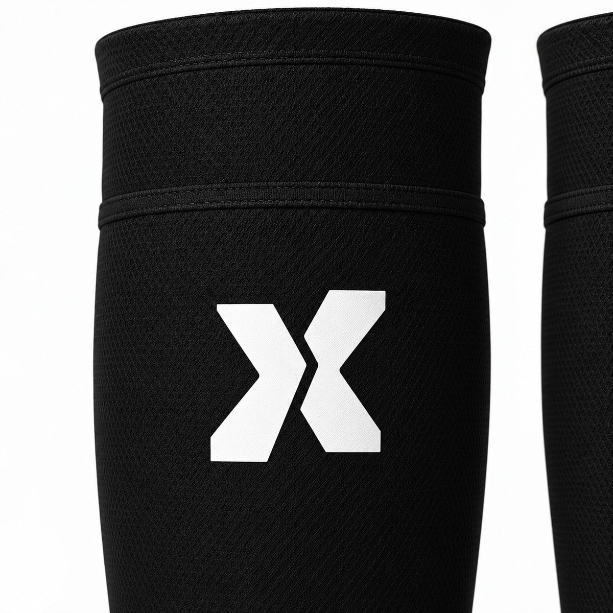 Détail du porte-protège-tibias junior et du symbole X EXTÉR